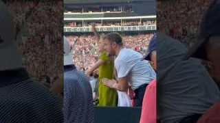 Dan Reynolds and his daughter Arrow at Taylor Swift concert
