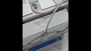 Ecovacs Winbot W2 window cleaning robot - Reeling back the cord